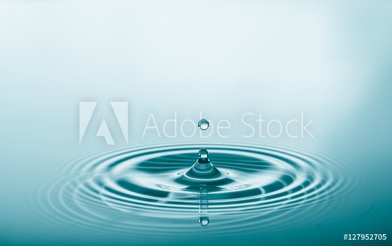 Picture of Water drop falling and drips on water mirror Water drop splash and make perfect circles on water surface